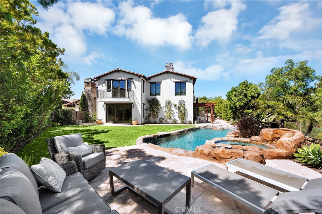 11 Hidden Pass Newport Coast, CA 92657 - Photo 55 of 59 a view of a house with backyard and a garden