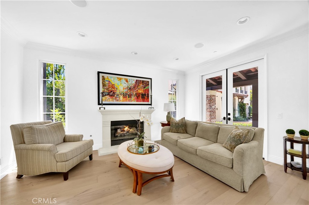 11 Hidden Pass Newport Coast, CA 92657 - Photo 8 of 59 a living room with furniture and a fireplace