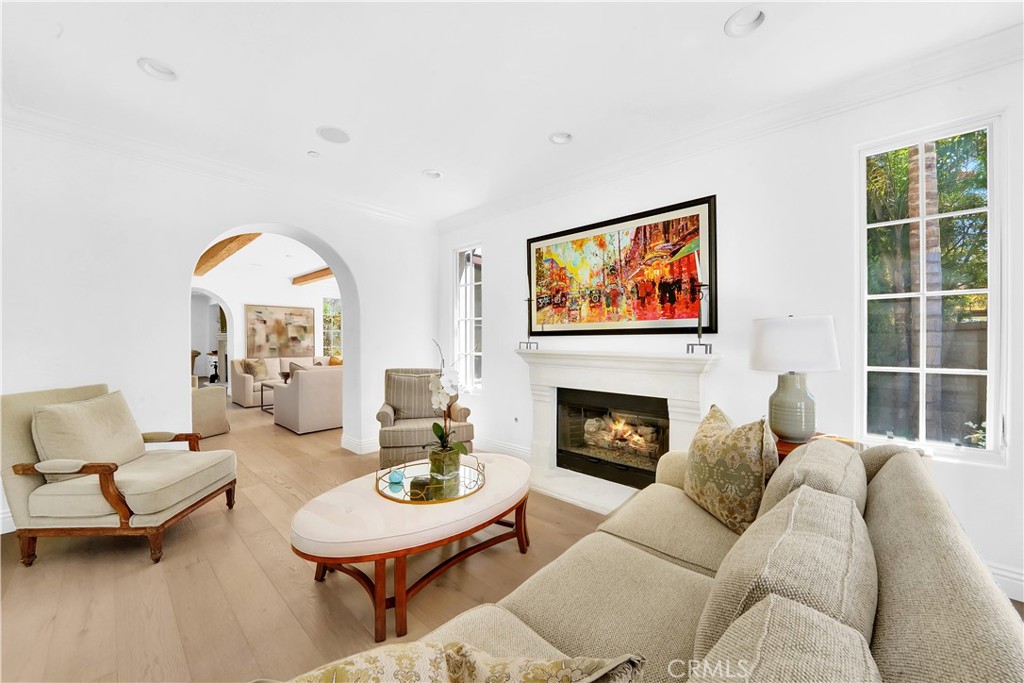 11 Hidden Pass Newport Coast, CA 92657 - Photo 9 of 59 a living room with furniture two window and a fireplace