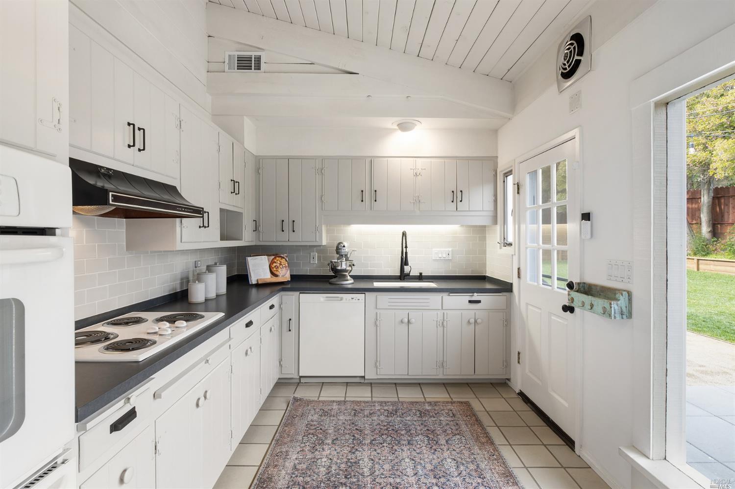 9 Bay Vista Drive Mill Valley, CA 94941 - Photo 17 of 34 a kitchen with granite countertop a sink stove and refrigerator