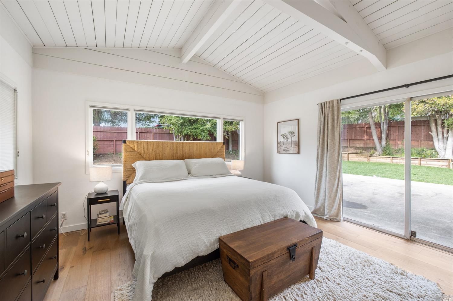 9 Bay Vista Drive Mill Valley, CA 94941 - Photo 20 of 34 a spacious bedroom with a bed and wooden floor