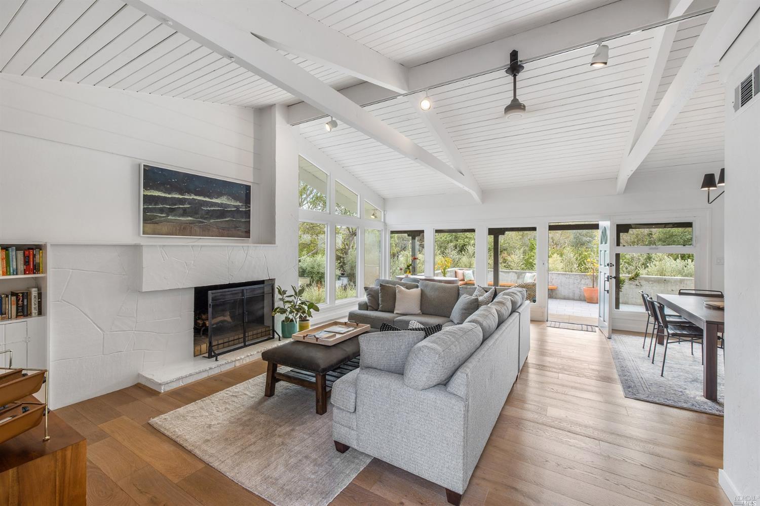 9 Bay Vista Drive Mill Valley, CA 94941 - Photo 8 of 34 a living room with furniture and a fireplace