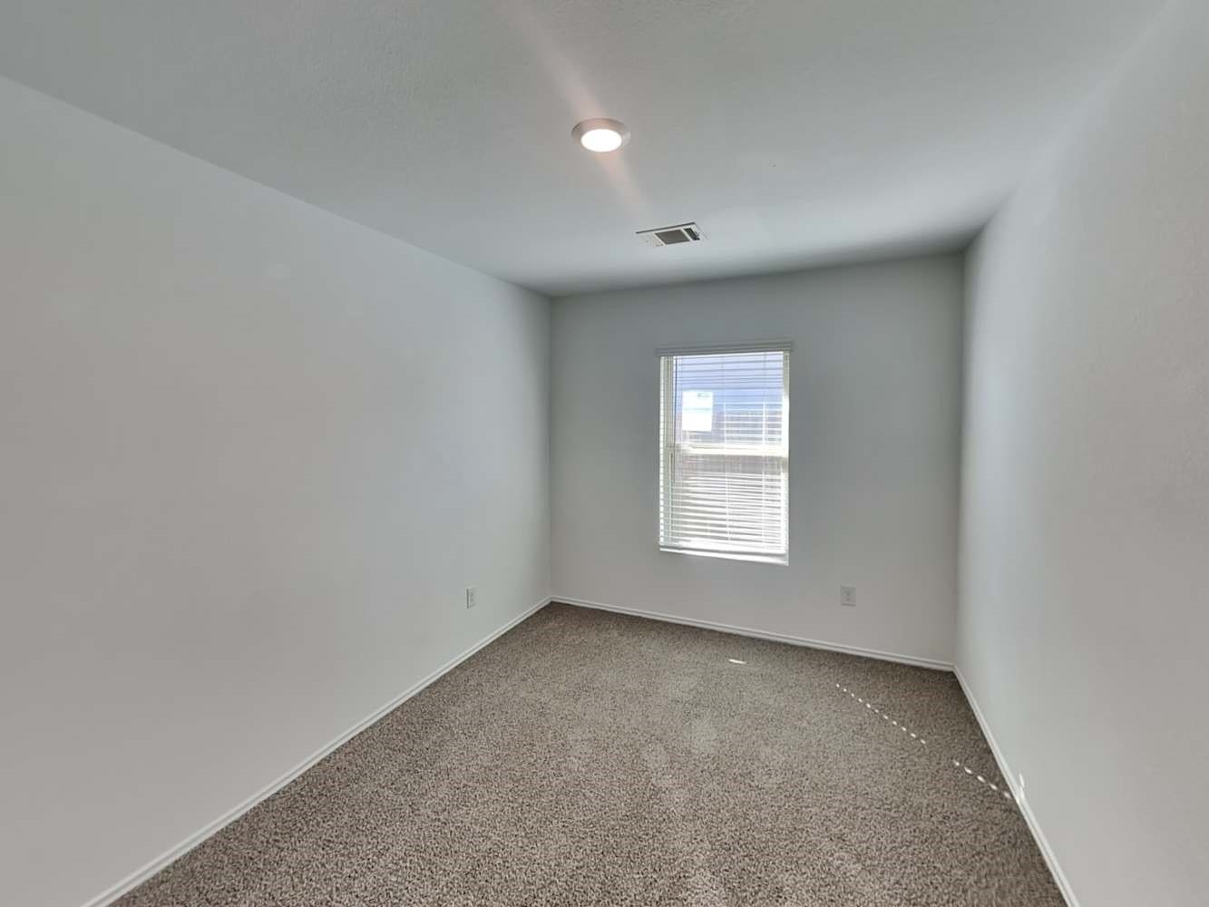 5936 Rimini Landing Lane Porter, TX 77365 - Photo 11 of 15 an empty room with a window