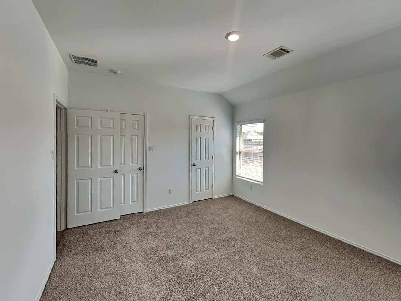 5936 Rimini Landing Lane Porter, TX 77365 - Photo 8 of 15 a view of an empty room with windows