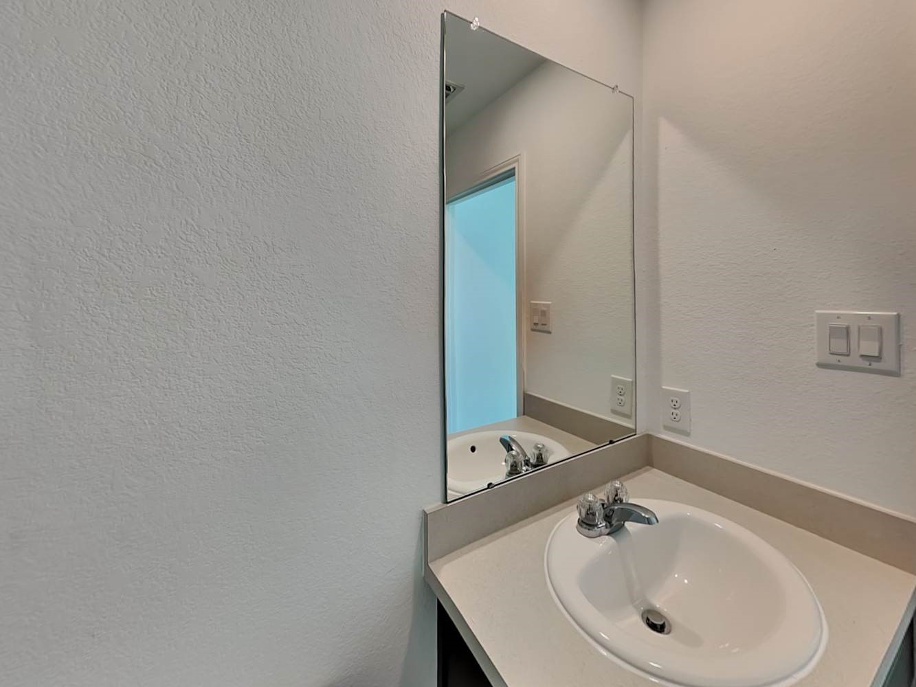 5936 Rimini Landing Lane Porter, TX 77365 - Photo 9 of 15 a bathroom with a sink and a mirror