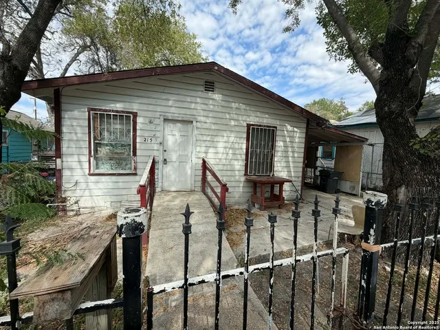 front view of house with a table and chairs