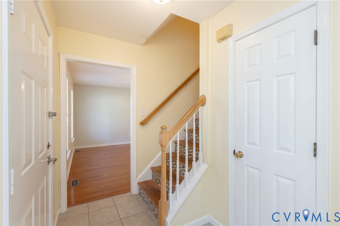 5101 Spring Bluff Road Midlothian, VA 23112 - Photo 7 of 47 Tiled entryway featuring a staircase with wood rai