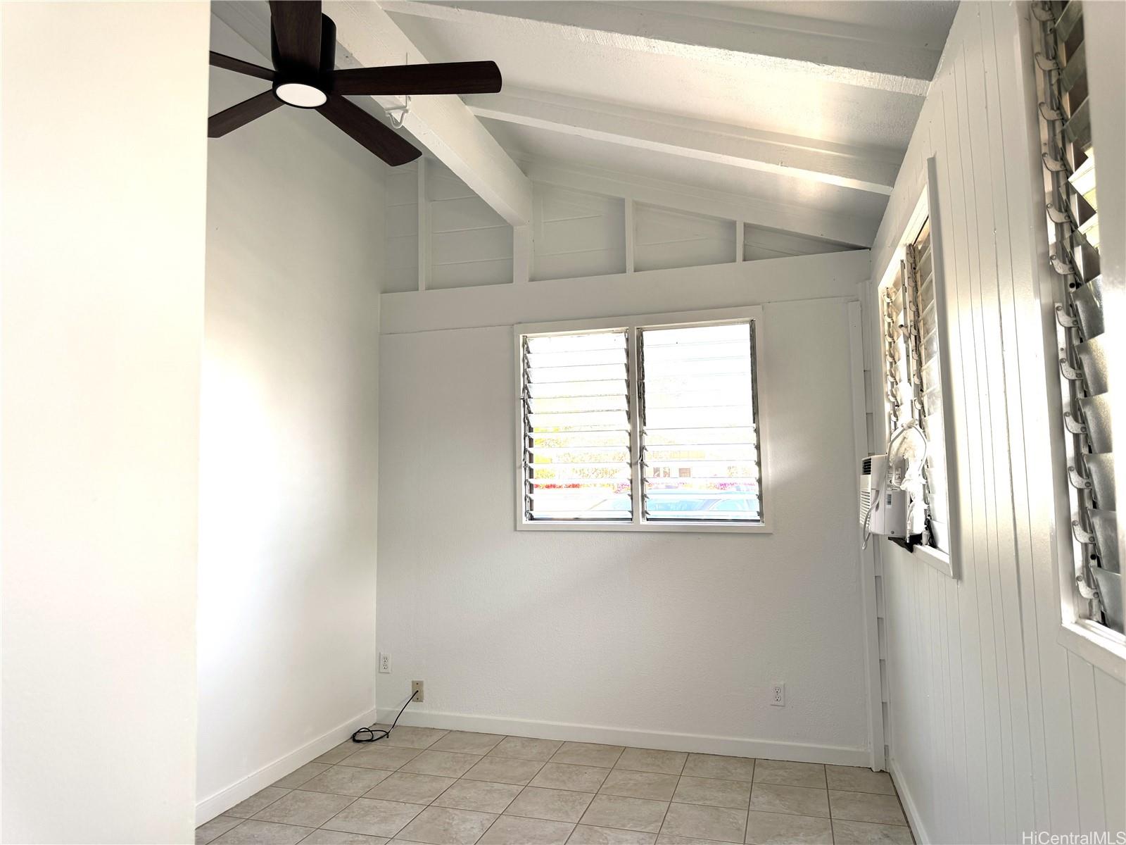 678 Auwina Street, Unit 3 Kailua, HI 96734 - Photo 5 of 11 an empty room with windows