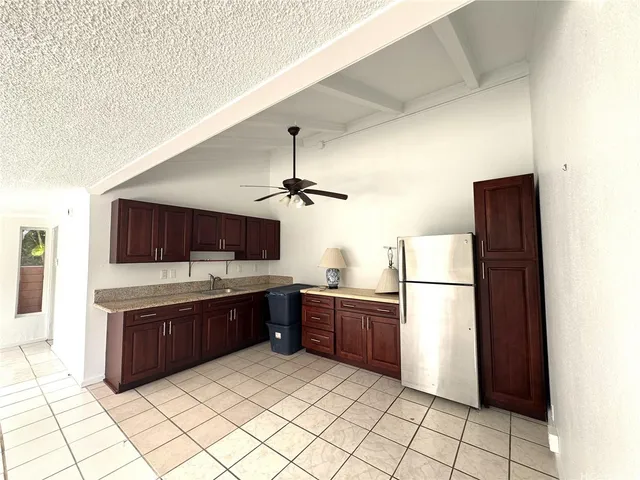 a kitchen with stainless steel appliances a refrigerator and a sink