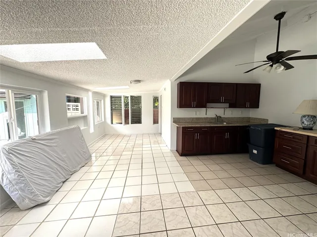 a room with a bed and a television