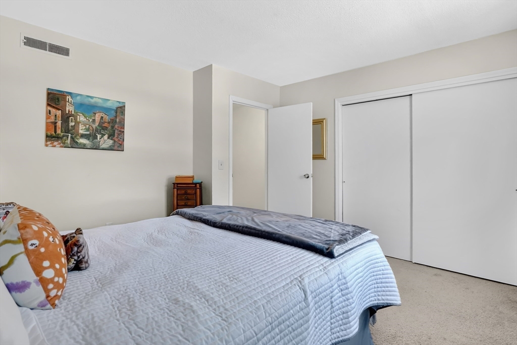 80 Yorktown Drive, Unit 80 Springfield, MA 01108 - Photo 15 of 24 a bedroom with a bed and a window