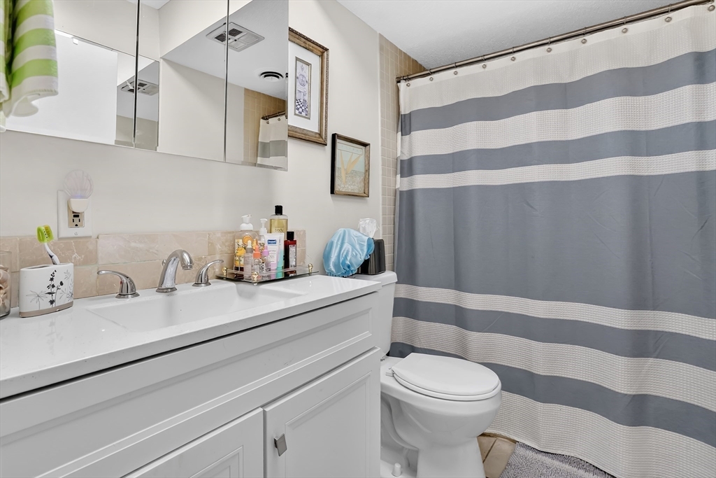 80 Yorktown Drive, Unit 80 Springfield, MA 01108 - Photo 16 of 24 a bathroom with a sink toilet and shower