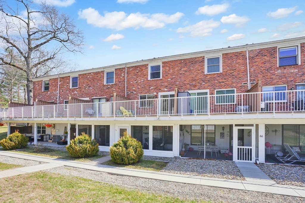 80 Yorktown Drive, Unit 80 Springfield, MA 01108 - Photo 20 of 24 a front view of a building with porch