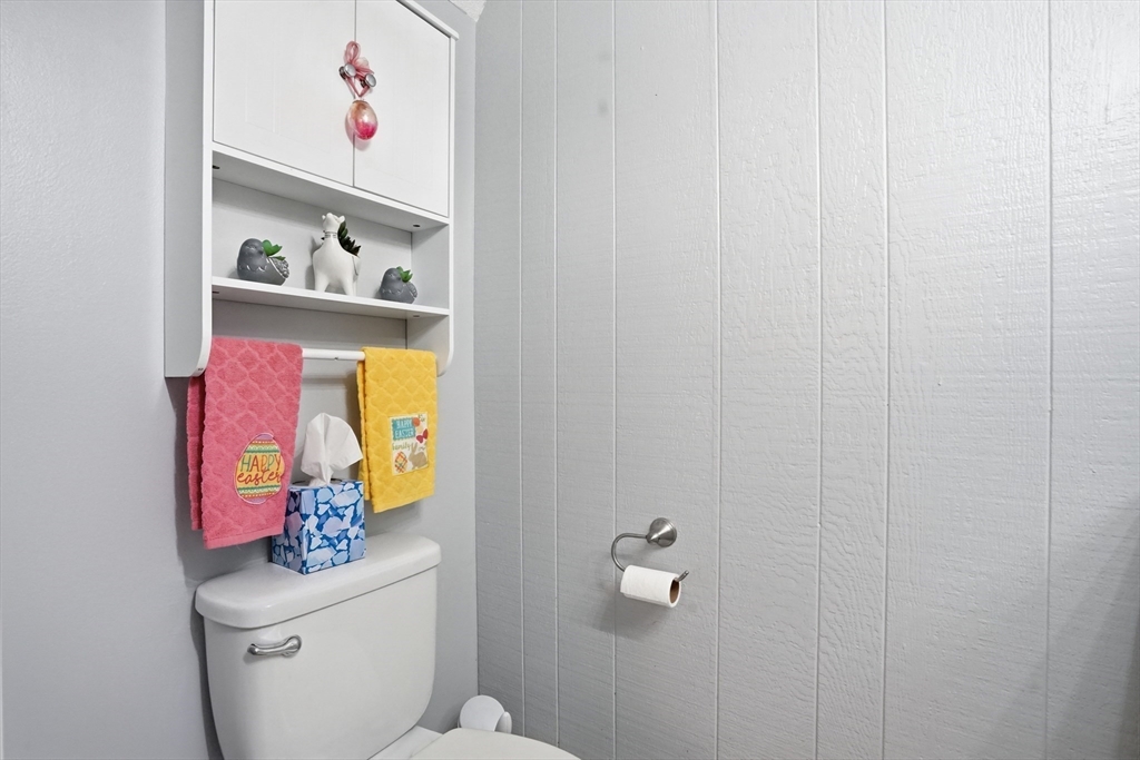80 Yorktown Drive, Unit 80 Springfield, MA 01108 - Photo 8 of 24 a bathroom with a small shelf with toilet and vanity