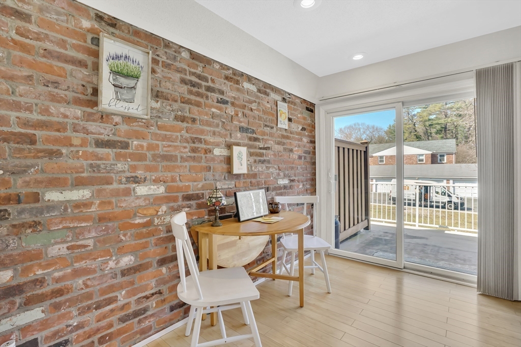 80 Yorktown Drive, Unit 80 Springfield, MA 01108 - Photo 10 of 24 a dining room with furniture and wooden floor