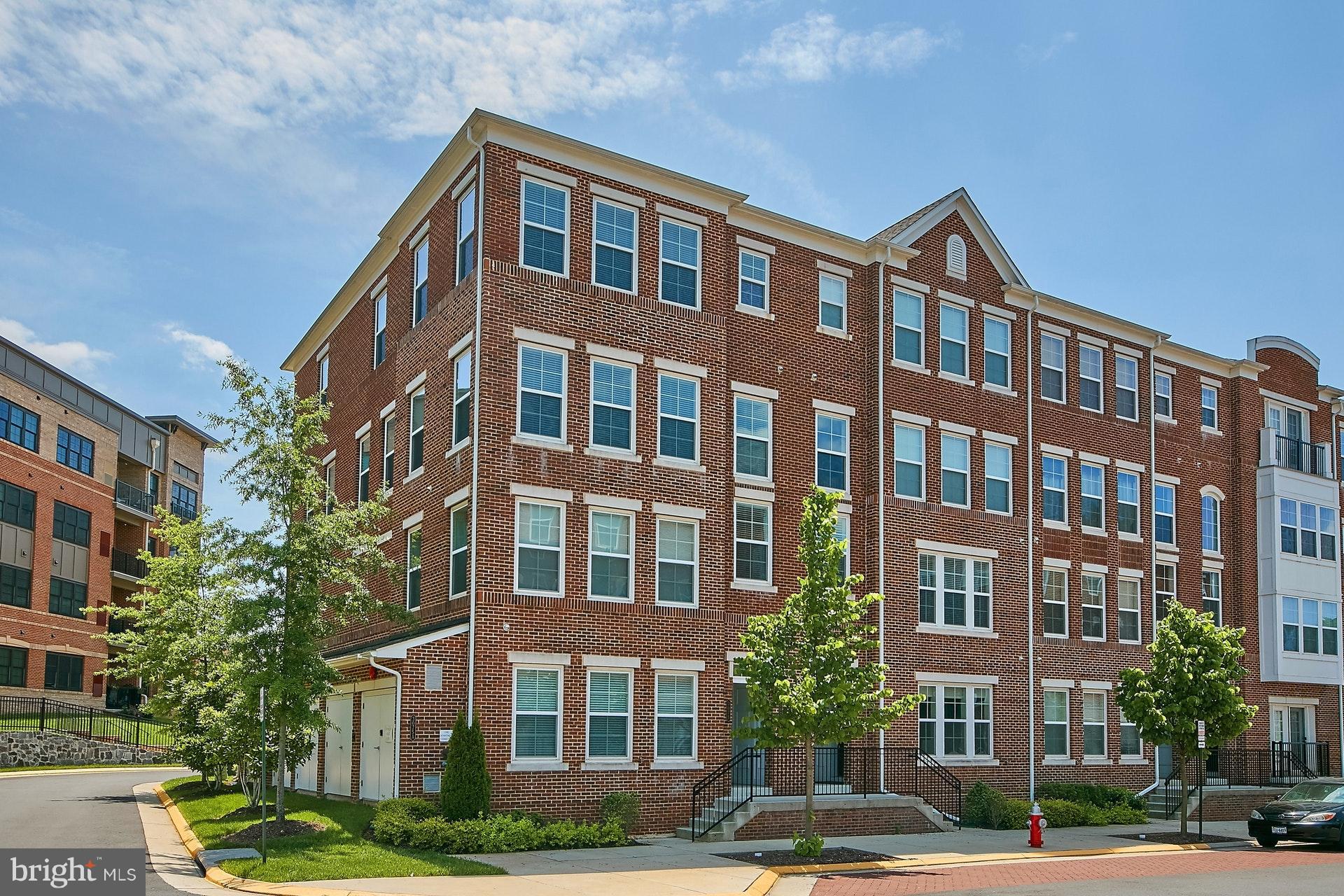 3073 Rittenhouse Circle, Unit 60 Fairfax, VA 22031 - Photo 1 of 30 a front view of a building with lot of trees and plants