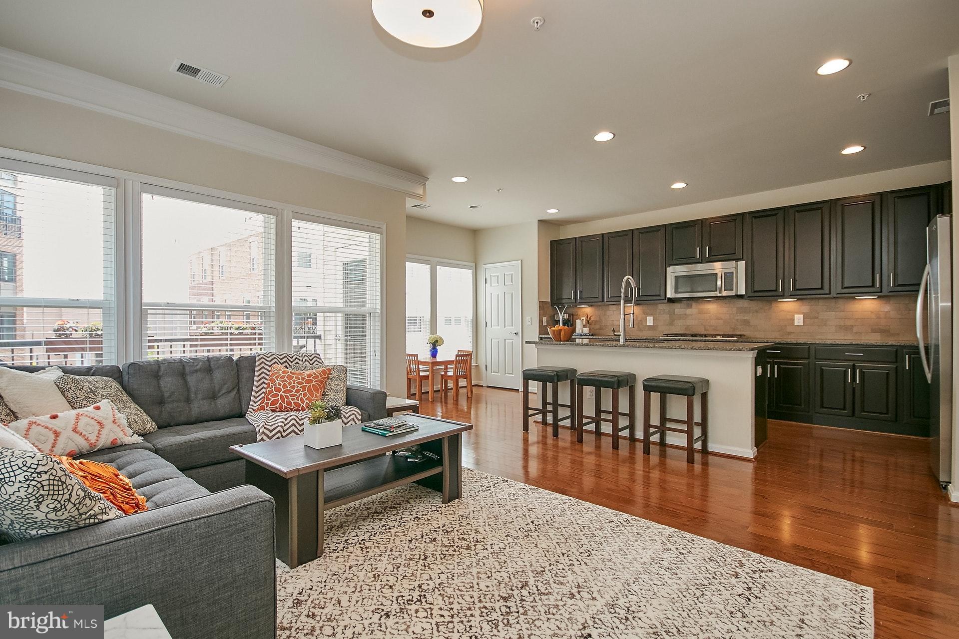 3073 Rittenhouse Circle, Unit 60 Fairfax, VA 22031 - Photo 15 of 30 a living room with fireplace furniture and a wooden floor