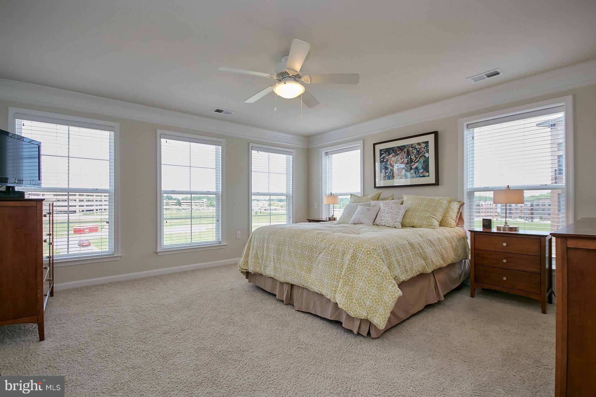 3073 Rittenhouse Circle, Unit 60 Fairfax, VA 22031 - Photo 19 of 30 a spacious bedroom with a bed and a large window