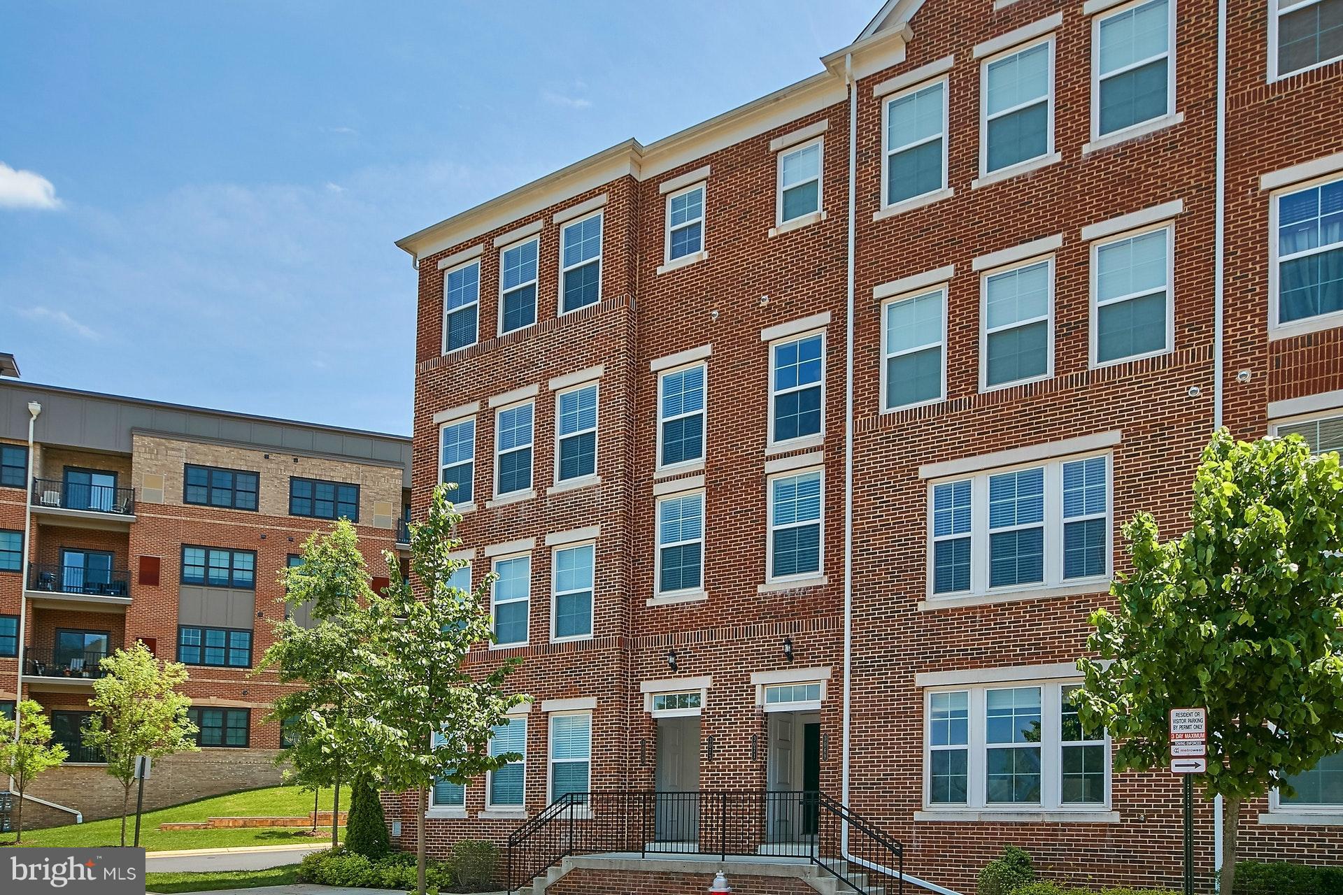 3073 Rittenhouse Circle, Unit 60 Fairfax, VA 22031 - Photo 2 of 30 a front view of a building with a yard