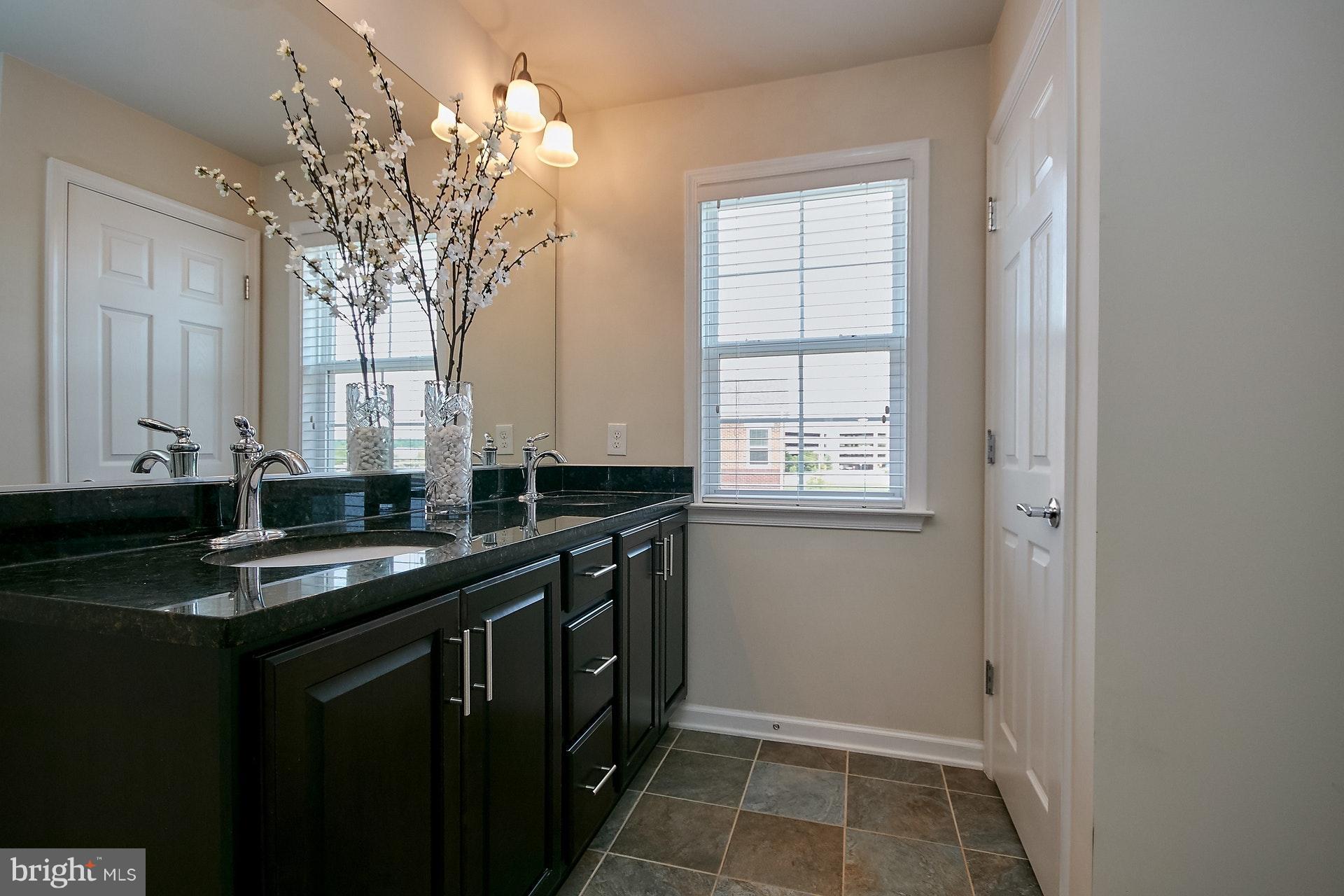 3073 Rittenhouse Circle, Unit 60 Fairfax, VA 22031 - Photo 22 of 30 a kitchen with a sink and cabinets