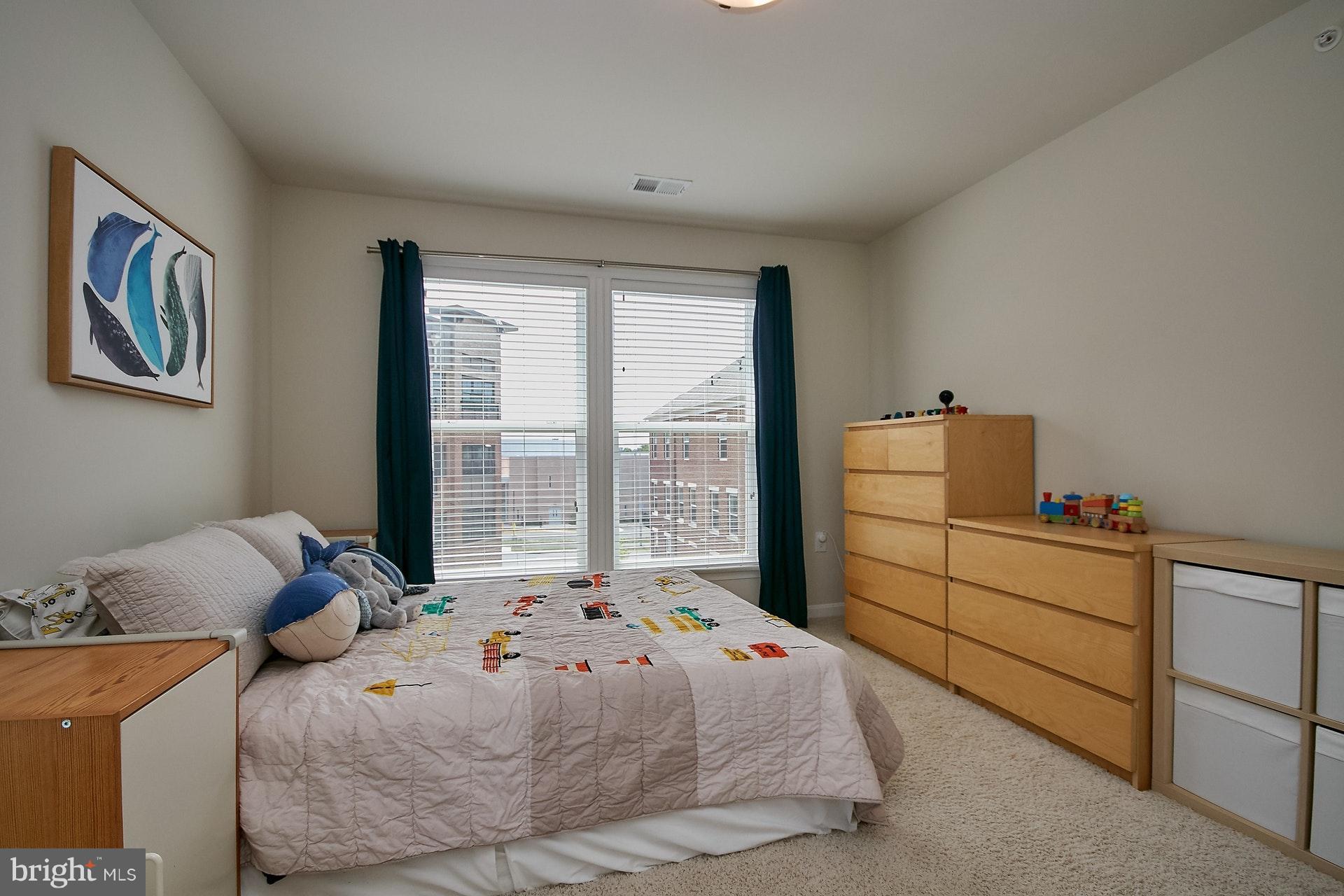 3073 Rittenhouse Circle, Unit 60 Fairfax, VA 22031 - Photo 26 of 30 a bedroom with a bed and window