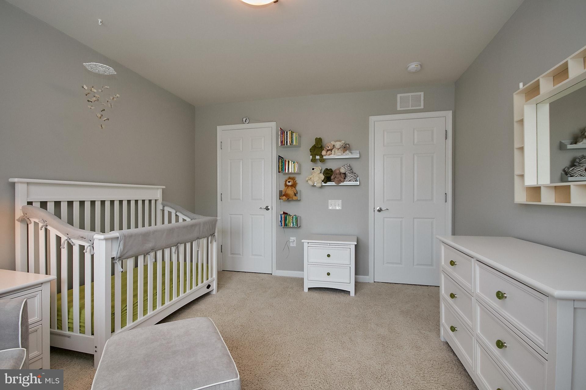 3073 Rittenhouse Circle, Unit 60 Fairfax, VA 22031 - Photo 29 of 30 a bedroom with a bed and wooden floor