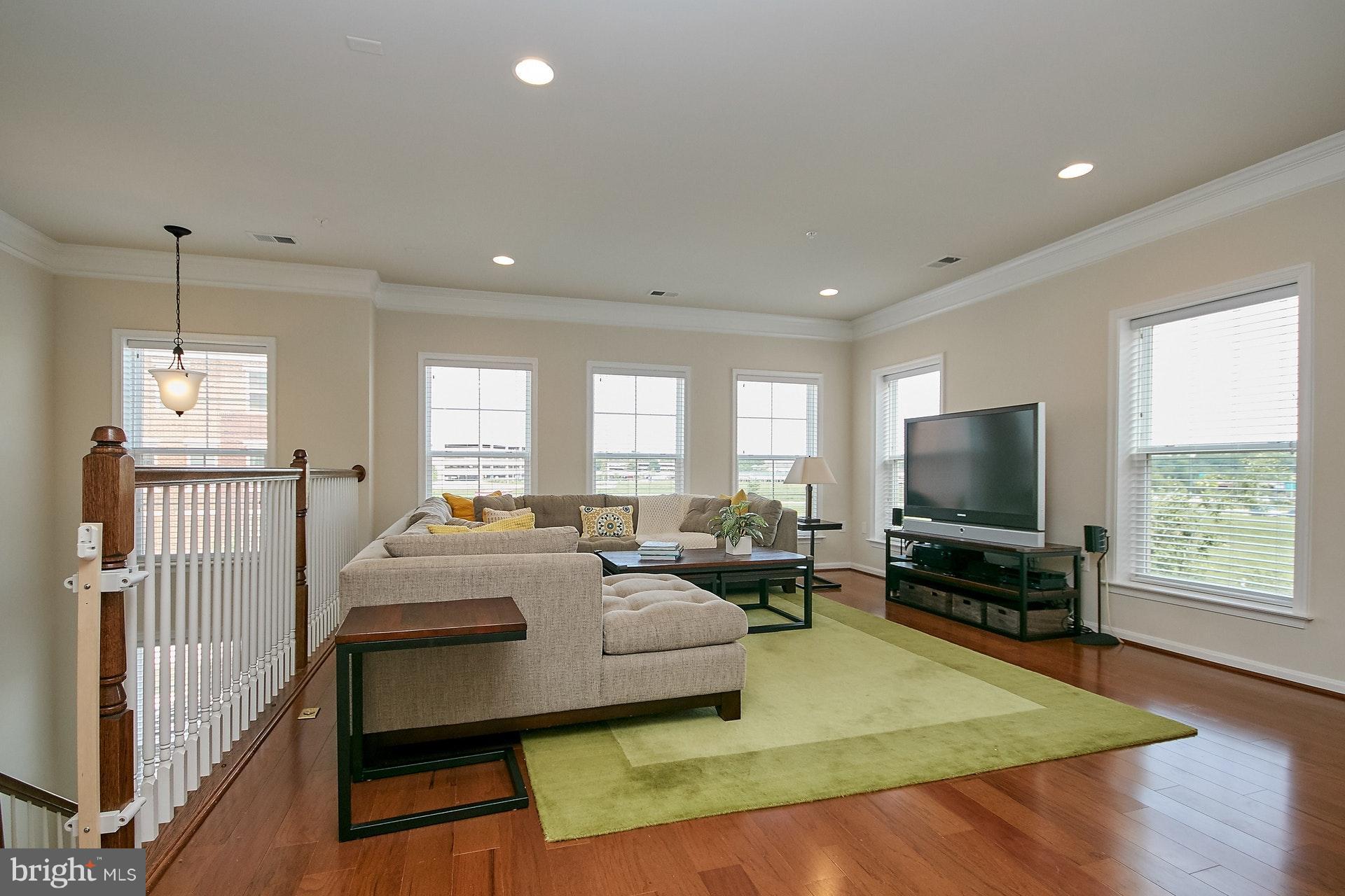 3073 Rittenhouse Circle, Unit 60 Fairfax, VA 22031 - Photo 4 of 30 a living room with furniture and a flat screen tv