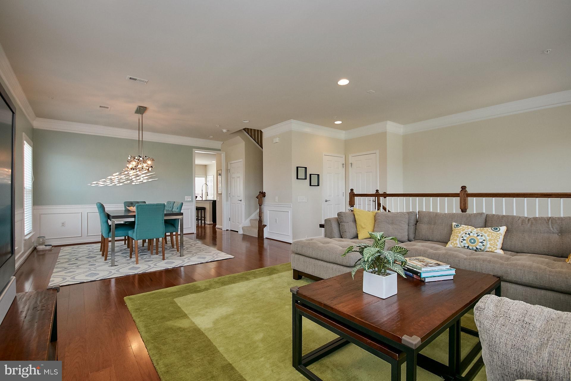 3073 Rittenhouse Circle, Unit 60 Fairfax, VA 22031 - Photo 5 of 30 a living room with furniture and a chandelier