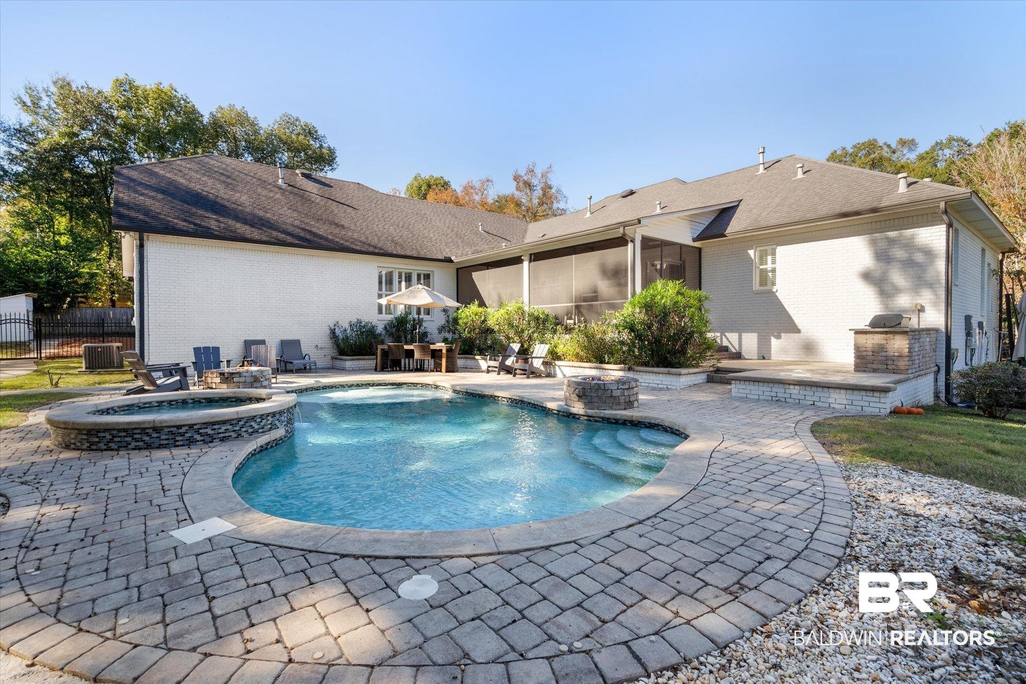 3713 Old Shell Road Mobile, AL 36608 - Photo 42 of 52 View of pool featuring a sunroom, a patio area, central air condition unit, and an in ground hot tub
