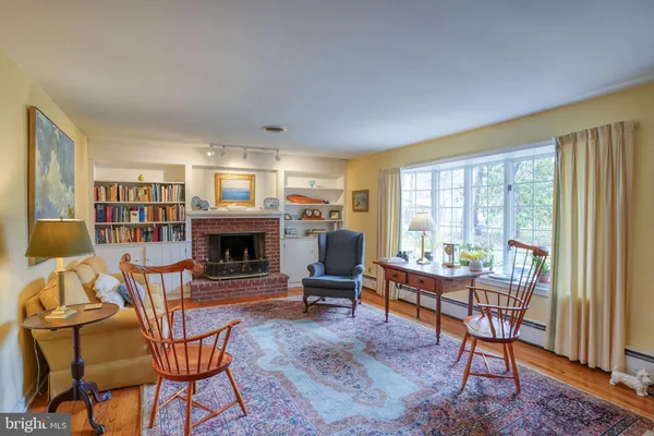 a dining room with furniture wooden floor a chandelier
