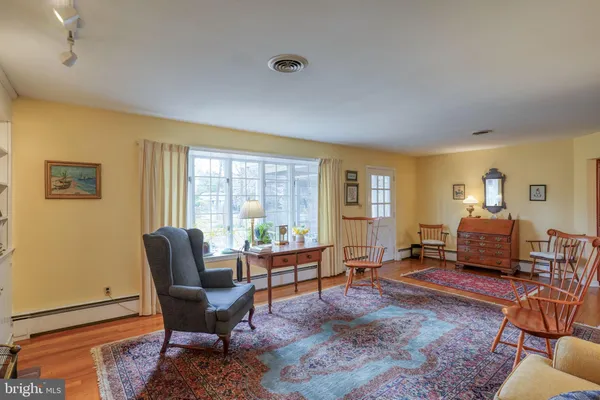 a kitchen with a sink cabinets and window