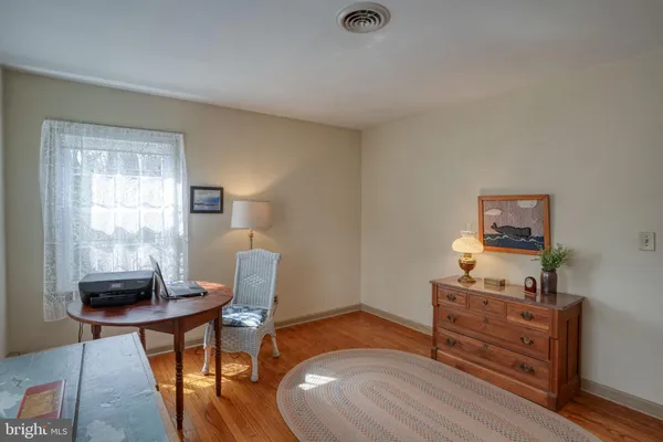 a bedroom with a bed and a chair