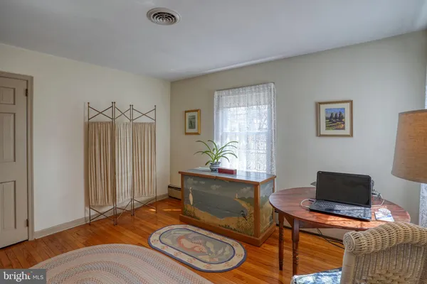 a very nice looking room with a large window and a chandelier