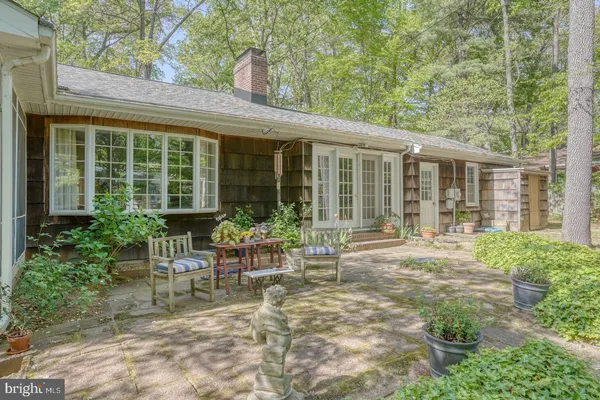 a view of a street with a house in the background
