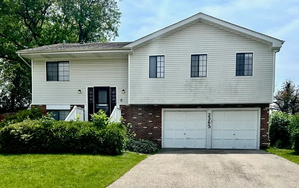 a front view of a house with a garage