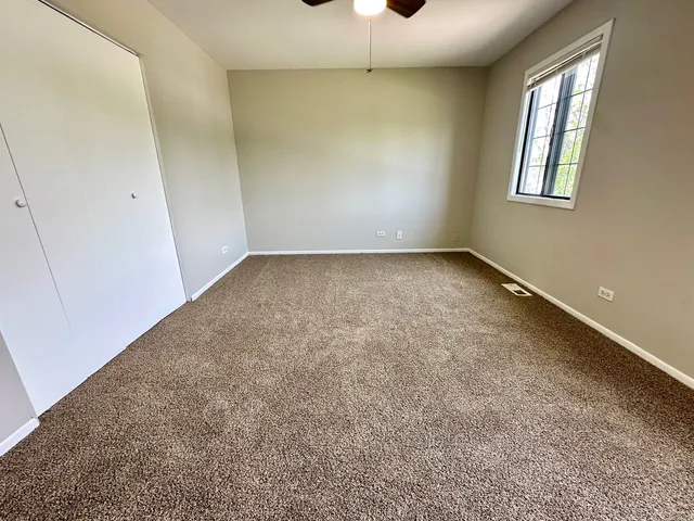 an empty room with a empty space and windows