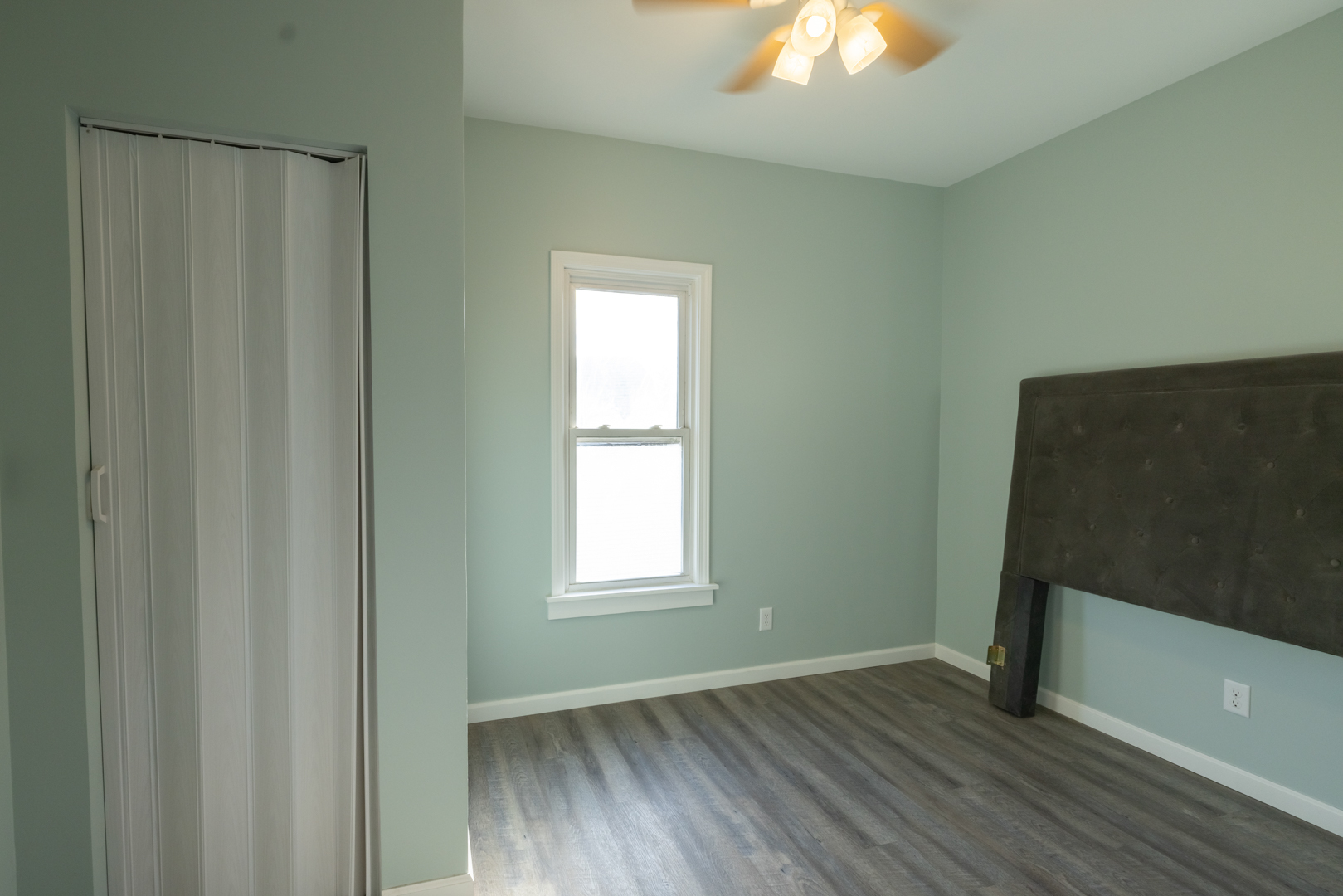 394 West Hawkins Street Kankakee, IL 60901 - Photo 18 of 26 an empty room with wooden floor closet and windows