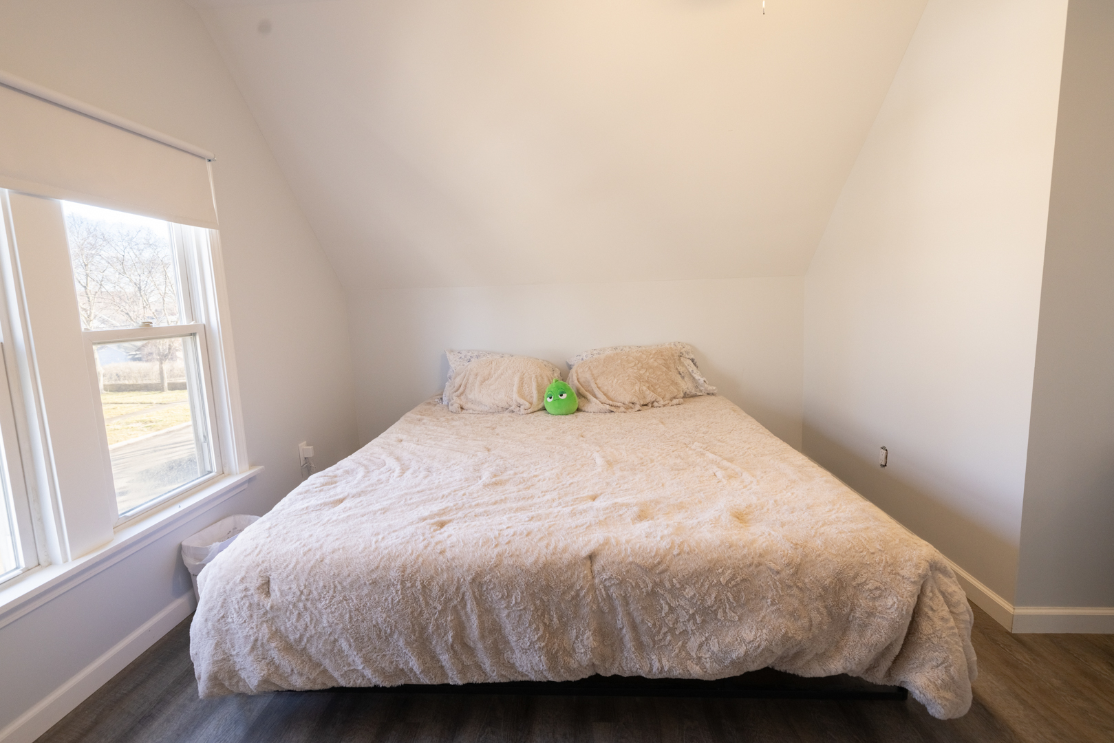 394 West Hawkins Street Kankakee, IL 60901 - Photo 23 of 26 a bed sitting in a bedroom next to a window