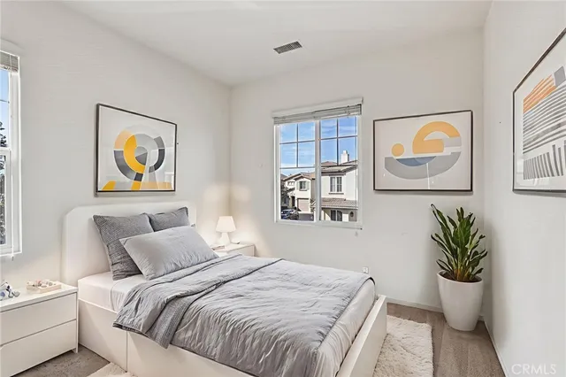 a spacious bathroom with a toilet sink and mirror