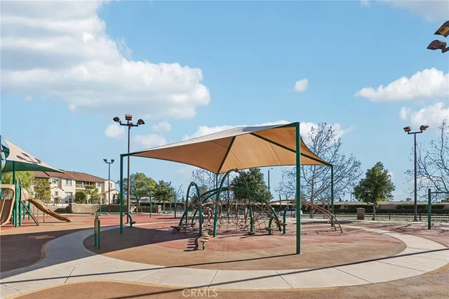 an aerial view of a residential houses with outdoor space and garden