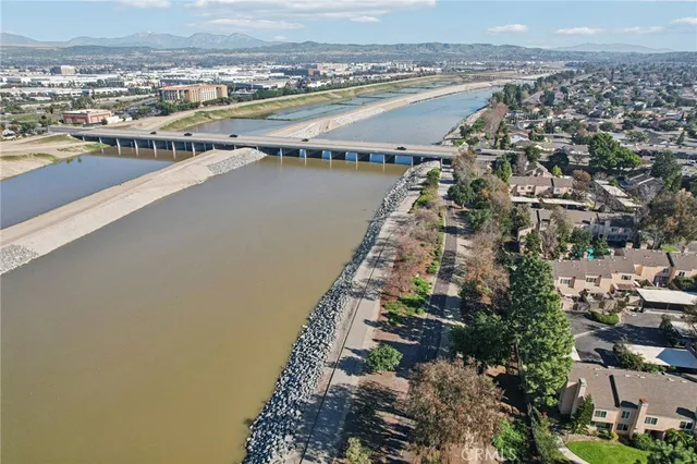 an aerial view of a residential houses with outdoor space