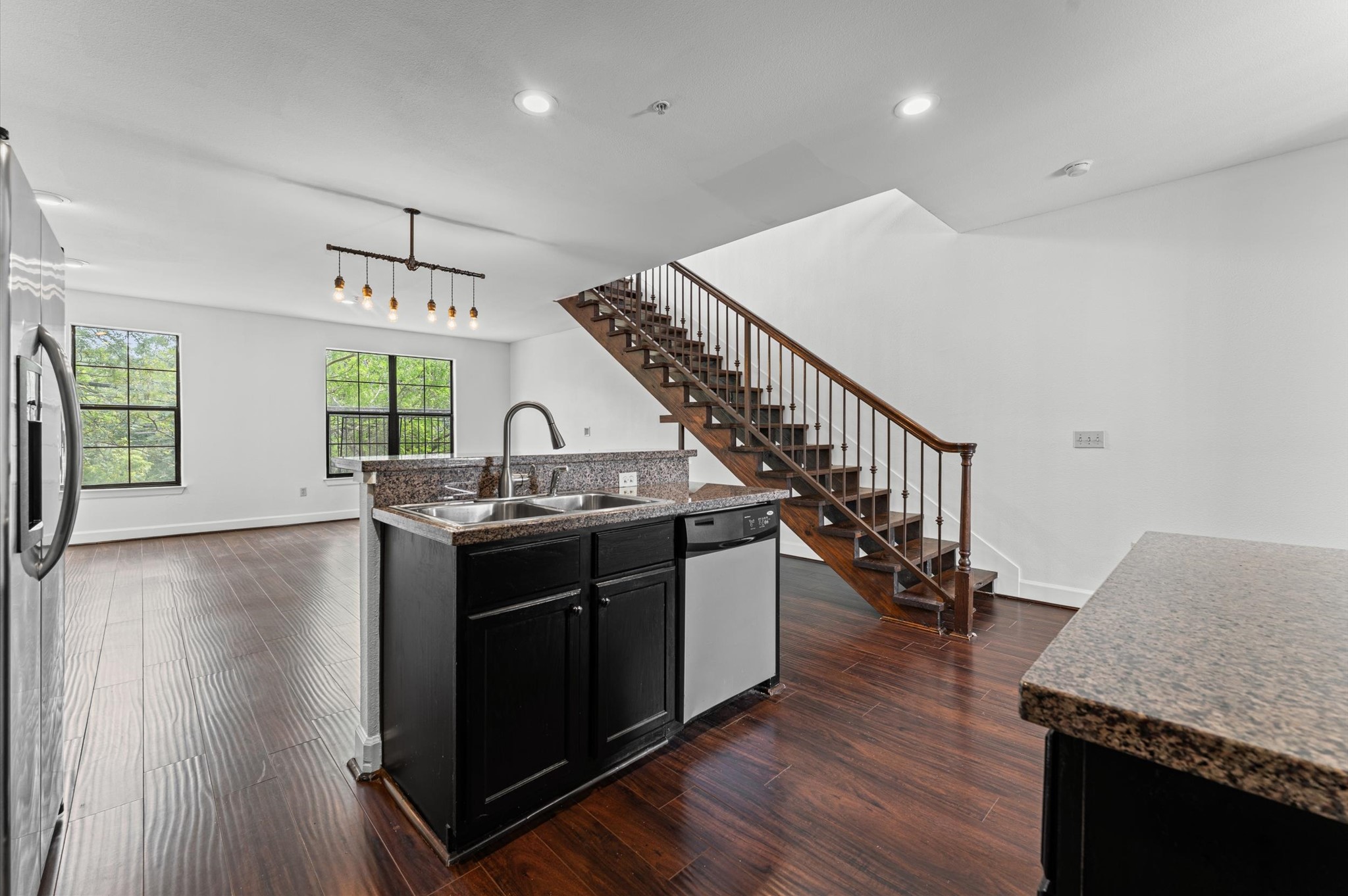 1602 Elgin Street, Unit 10 Houston, TX 77004 - Photo 3 of 21 The kitchen and living areas connect seamlessly, creating a comfortable, open feel throughout the unit's first floor.