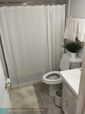 a view of a porch with furniture and a gate