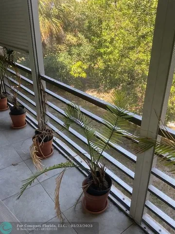 a view of a house with a backyard and a deck