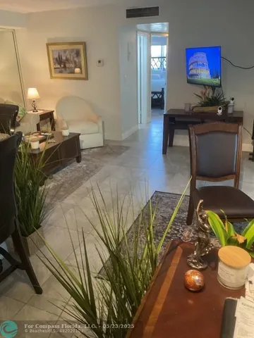 a bathroom with a sink a toilet and shower curtain