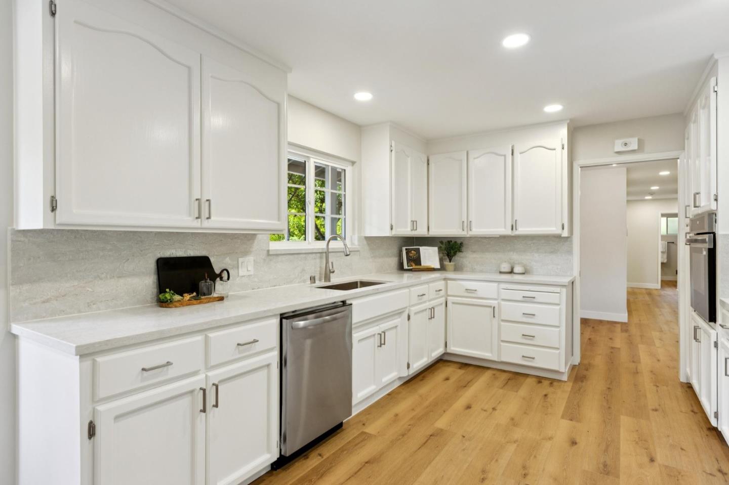 755 Santa Rita Avenue Los Altos, CA 94022 - Photo 16 of 50 a kitchen with white cabinets appliances and a sink