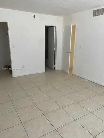 an empty room with a fireplace