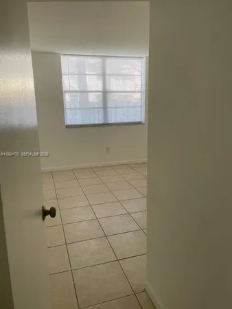 a bathroom with a bathtub and window