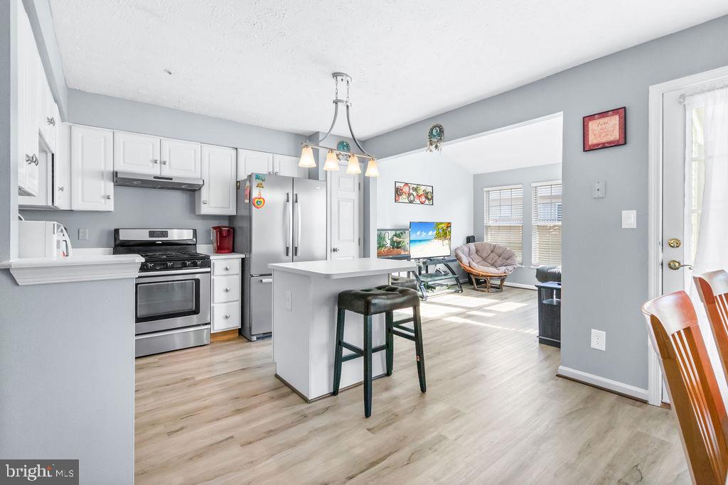 8605 Accokeek Street Laurel, MD 20724 - Photo 18 of 44 a kitchen with sink a counter and appliances