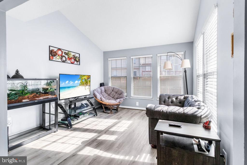 8605 Accokeek Street Laurel, MD 20724 - Photo 19 of 44 a living room with furniture and a flat screen tv